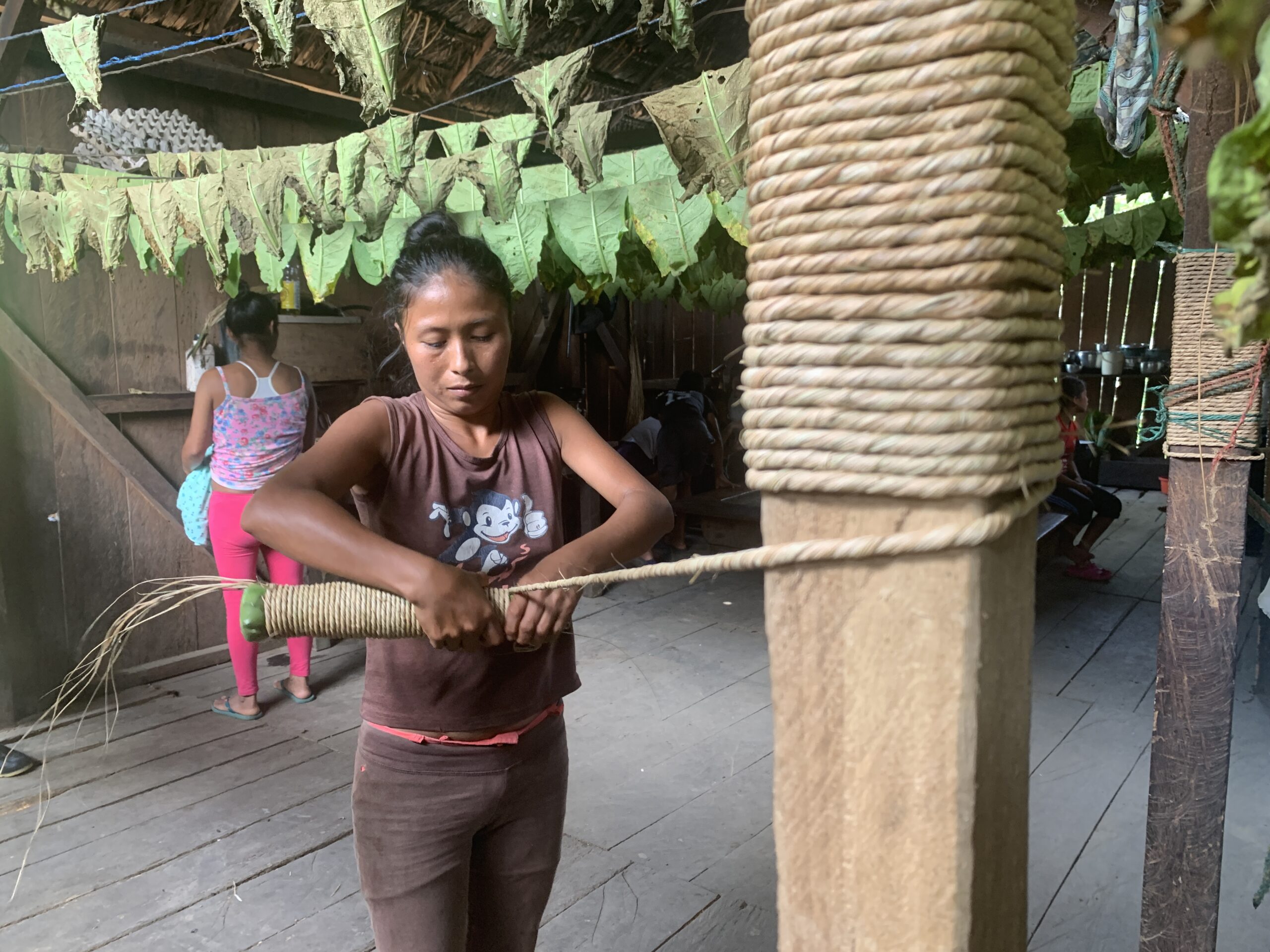 kichewa woman preparing mapacho tobacco roll