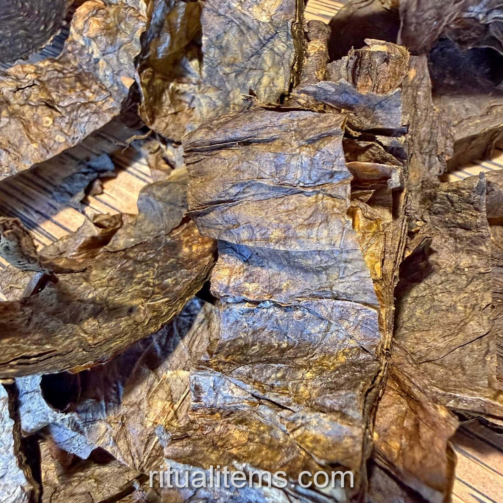 Close-up of brown Mapacho leaf strips showing creases and layered edges.